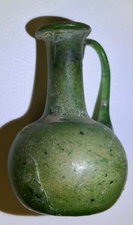 Small Green Blown Glass Pitcher, Possibly of Roman Origin, Lacking Provenance.  3 1/2" tall