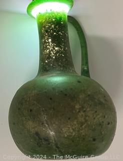 Small Green Blown Glass Pitcher, Possibly of Roman Origin, Lacking Provenance.  3 1/2" tall