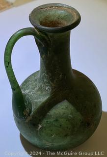 Small Green Blown Glass Pitcher, Possibly of Roman Origin, Lacking Provenance.  3 1/2" tall