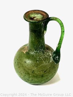 Small Green Blown Glass Pitcher, Possibly of Roman Origin, Lacking Provenance.  3 1/2" tall