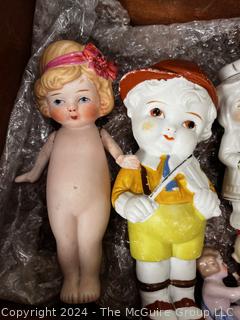 Wooden Box Full of Articulated Porcelain Dolls 