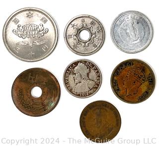 Seven (7) Foreign Coins