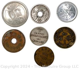 Seven (7) Foreign Coins