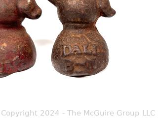 Two (2) Miniature Cast Iron Promotional Dog Paper Weights Stamped Dall B-N & Neil Pup.