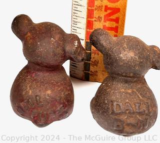 Two (2) Miniature Cast Iron Promotional Dog Paper Weights Stamped Dall B-N & Neil Pup.