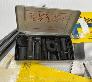 Assortedment of Hand Tools including Metal Folding Rule, New Pole Saw Blade, Adjustable Circular Clamps and Metal Brackets