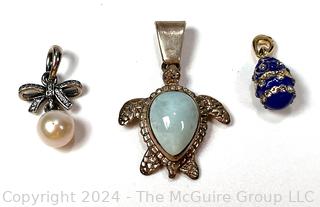 Three (3) Pendants Including Sterling Turtle, Pandora Sterling Silver Pearl and Enamel Egg