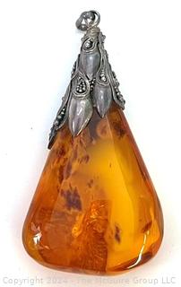 Large Amber Pendant with Ornate Silver Mount. 3" long, 31.6 grams