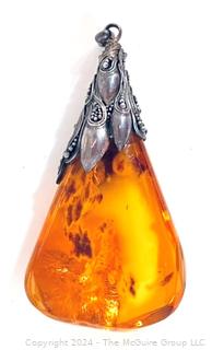 Large Amber Pendant with Ornate Silver Mount. 3" long, 31.6 grams