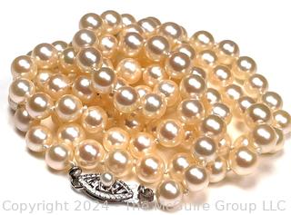 Opera Length Knotted Pearls with 14kt White Gold Clasp. 24" long.