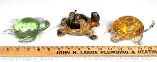 Three (3) Decorative Turtles Including Lenox Blown Glass Paperweights and Enamel Painted Trinket Box.  