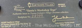 (4) Lighted Buildings of Hawthorne Village Thomas Kinkade's Christmas Collection in Original Styrefoam: Village Post Office (#A5769) Light of Hope Church (#40949) Victorian Homestead (#D6485) Santa's Workshop Toys (#D8749)