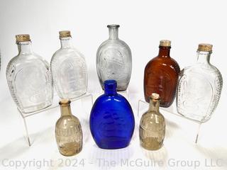 Eight (8) Glass Whiskey Flasks