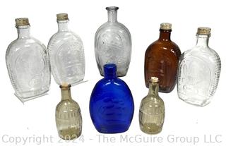 Eight (8) Glass Whiskey Flasks