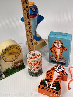 1965 Popeye Spinach Can Coin Bank, 1987 Star-Kist Tuna Telephone, Tony the Tiger Radio, Complete With Box and 1974 Bugs Bunny Talking Alarm Clock Wind Up (untested)