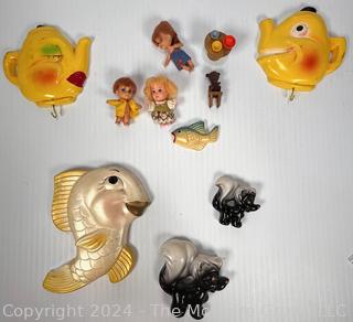 Mid Century Chalkware Fish, Mr & Mrs Teapot Potholder and Skunk Family Chalkware Wall Hangings with Assorted Mini Dolls