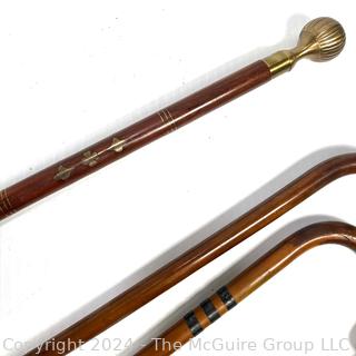 Four (4) Wooden Canes Including Crooked, Metal Pommel and Inlays