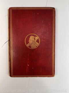 "The Hunting of the Snark: An Agony in Eight Fits" by Lewis Carroll. 

London: MacMillan and Co., 1876. xi,(3),83 pp. 12 mo. Dark Red Front and Rear Boards with Gilt Pictorial Illustrations by Henry Holiday. All edges gilt. Original black endpapers. Printed in London by R. Clay Sons & Taylor. Half title. One old ownership signature. Original plate tissue on Title Page. Last unnumbered leaf contains advertisements for Carrol's other works. A First Edition, this Issue Contains "Baker" for "Butcher" on p83. A fantastical poem involving a strange crew of tradesmen and a beaver as they set off on a journey to find "the Snark". 

1876 First Edition, 17th Printing of 1,000 {Description Updated 9/19/24 at 4:27pm ET}