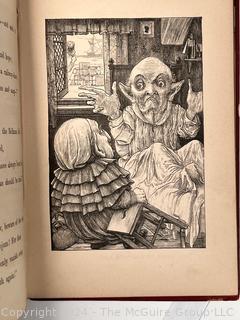 "The Hunting of the Snark: An Agony in Eight Fits" by Lewis Carroll. 

London: MacMillan and Co., 1876. xi,(3),83 pp. 12 mo. Dark Red Front and Rear Boards with Gilt Pictorial Illustrations by Henry Holiday. All edges gilt. Original black endpapers. Printed in London by R. Clay Sons & Taylor. Half title. One old ownership signature. Original plate tissue on Title Page. Last unnumbered leaf contains advertisements for Carrol's other works. A First Edition, this Issue Contains "Baker" for "Butcher" on p83. A fantastical poem involving a strange crew of tradesmen and a beaver as they set off on a journey to find "the Snark". 

1876 First Edition, 17th Printing of 1,000 {Description Updated 9/19/24 at 4:27pm ET}