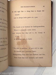 "The Hunting of the Snark: An Agony in Eight Fits" by Lewis Carroll. 

London: MacMillan and Co., 1876. xi,(3),83 pp. 12 mo. Dark Red Front and Rear Boards with Gilt Pictorial Illustrations by Henry Holiday. All edges gilt. Original black endpapers. Printed in London by R. Clay Sons & Taylor. Half title. One old ownership signature. Original plate tissue on Title Page. Last unnumbered leaf contains advertisements for Carrol's other works. A First Edition, this Issue Contains "Baker" for "Butcher" on p83. A fantastical poem involving a strange crew of tradesmen and a beaver as they set off on a journey to find "the Snark". 

1876 First Edition, 17th Printing of 1,000 {Description Updated 9/19/24 at 4:27pm ET}