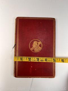 "The Hunting of the Snark: An Agony in Eight Fits" by Lewis Carroll. 

London: MacMillan and Co., 1876. xi,(3),83 pp. 12 mo. Dark Red Front and Rear Boards with Gilt Pictorial Illustrations by Henry Holiday. All edges gilt. Original black endpapers. Printed in London by R. Clay Sons & Taylor. Half title. One old ownership signature. Original plate tissue on Title Page. Last unnumbered leaf contains advertisements for Carrol's other works. A First Edition, this Issue Contains "Baker" for "Butcher" on p83. A fantastical poem involving a strange crew of tradesmen and a beaver as they set off on a journey to find "the Snark". 

1876 First Edition, 17th Printing of 1,000 {Description Updated 9/19/24 at 4:27pm ET}