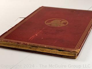 "The Hunting of the Snark: An Agony in Eight Fits" by Lewis Carroll. 

London: MacMillan and Co., 1876. xi,(3),83 pp. 12 mo. Dark Red Front and Rear Boards with Gilt Pictorial Illustrations by Henry Holiday. All edges gilt. Original black endpapers. Printed in London by R. Clay Sons & Taylor. Half title. One old ownership signature. Original plate tissue on Title Page. Last unnumbered leaf contains advertisements for Carrol's other works. A First Edition, this Issue Contains "Baker" for "Butcher" on p83. A fantastical poem involving a strange crew of tradesmen and a beaver as they set off on a journey to find "the Snark". 

1876 First Edition, 17th Printing of 1,000 {Description Updated 9/19/24 at 4:27pm ET}