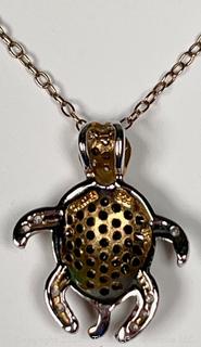 Two (2) Pendants. Sterling Silver Turtle and 825 Marcasite Cross