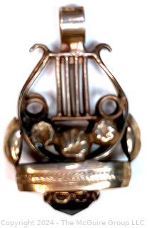 Sterling Silver Lyre Shaped Pendant with Garnet Stone 