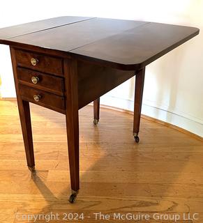 Sheraton Three Drawer Drop-Leaf Side or End Table on Casters.  31 x 25 x 26”