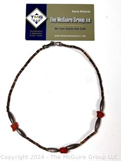 Shell Necklace with Red Beads.