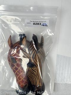 Two (2) Carved African Zebra and Giraffe Masks