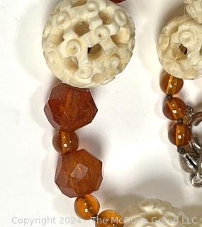 Faceted Amber and Pierced Bone Bead Necklace.  20" long