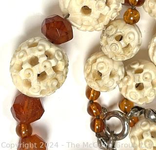 Faceted Amber and Pierced Bone Bead Necklace.  20" long