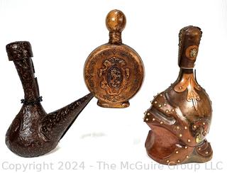 Three (3) Leather Covered Decanters