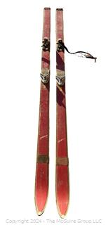 Red Wooden Skis with Bindings