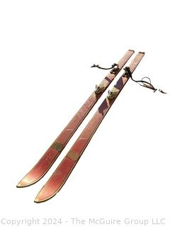 Red Wooden Skis with Bindings