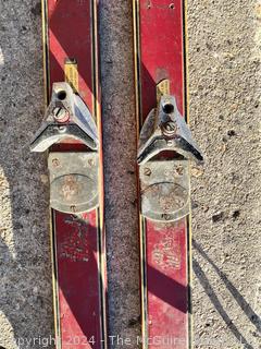 Red Wooden Skis with Bindings