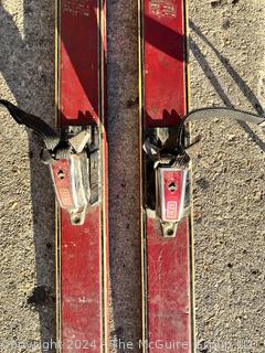 Red Wooden Skis with Bindings