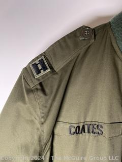 US Army Light Zippered Jacket, camo lined, Captain and CIB subdued insignia.