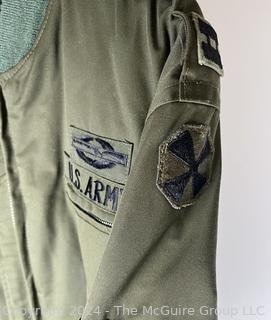 US Army Light Zippered Jacket, camo lined, Captain and CIB subdued insignia.