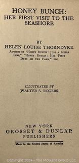 Two (2) Children's Books:  Honey Bunch: Her First Visit to The Seashore by Helen Louise Thorndyke and The Outdoor Girls of Deepdale by Laura Lee Hope