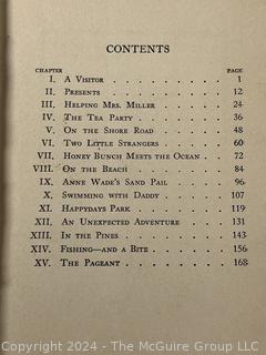 Two (2) Children's Books:  Honey Bunch: Her First Visit to The Seashore by Helen Louise Thorndyke and The Outdoor Girls of Deepdale by Laura Lee Hope