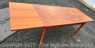 ??????????????? Mid Century Teak Expanding Dining Table.  Some wear to table top. 