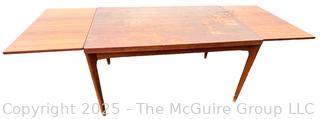 ??????????????? Mid Century Teak Expanding Dining Table.  Some wear to table top. 