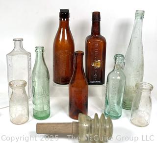 Nine (9) Glass Bottles and One (1) Glass Insulator