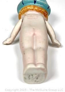 Bisque Porcelain Kewpie Doll With Flapper Hat and Jointed Arms made in Japan.  7" tall.