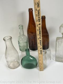 Seven (7) Antique Bottles from Privy Dig