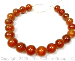 9" Strand of Carved Round Amber Beads 