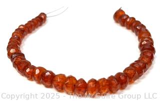 9" Strand of Carved Faceted Amber Beads. 