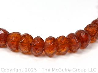 9" Strand of Carved Faceted Amber Beads. 